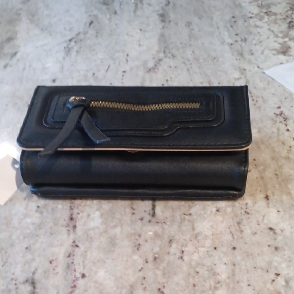 Sleek Black crossbody bag with Zipper Detail and removable cellphone case.